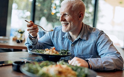 Man eating meal in restaurant