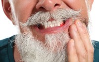 Bearded man in need of gum disease treatment in Wayland, MA